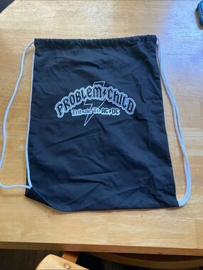 The black drawstring backpack featuring the logo for Problem Child,